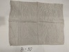 名称：本白色方格绉乔其纱
尺寸：37cm*91cm
年代：60年代
描述：乔其纱是以强捻绉经、绉纬制织的一种丝织物。经纬线均以加强捻的丝二左二右排列相间交织成平纹组织的绉类丝织物。一般是采用强捻纱并配合一定的织物组织结构制成的。经纬密度紧密，炼染后起收缩作用，绸面上起细致均匀的绉纹和明显的沙孔。
