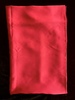 名称：素缎（红）
 
类别：丝织品
尺寸：16*11.3（厘米） 
年代：公元二十世纪
描述：素色纹样面料，红色。
