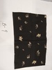 名称：黑地白蝶印花绉缎
 
尺寸：32*50（厘米）
年代：60年代
描述：丝织物,以经丝为平丝,强捻丝为纬丝,二左二右排列,采用缎纹组织交织。绉缎分为花绉缎、素绉缎两种。绉缎的原料一般为桑蚕丝。
